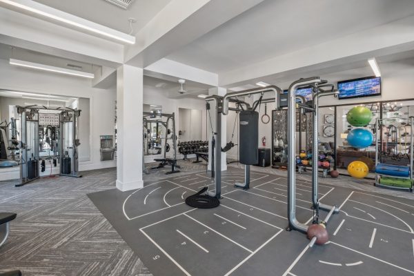 Fitness Center strengthening equipment including full body strengthening machines and free weights
